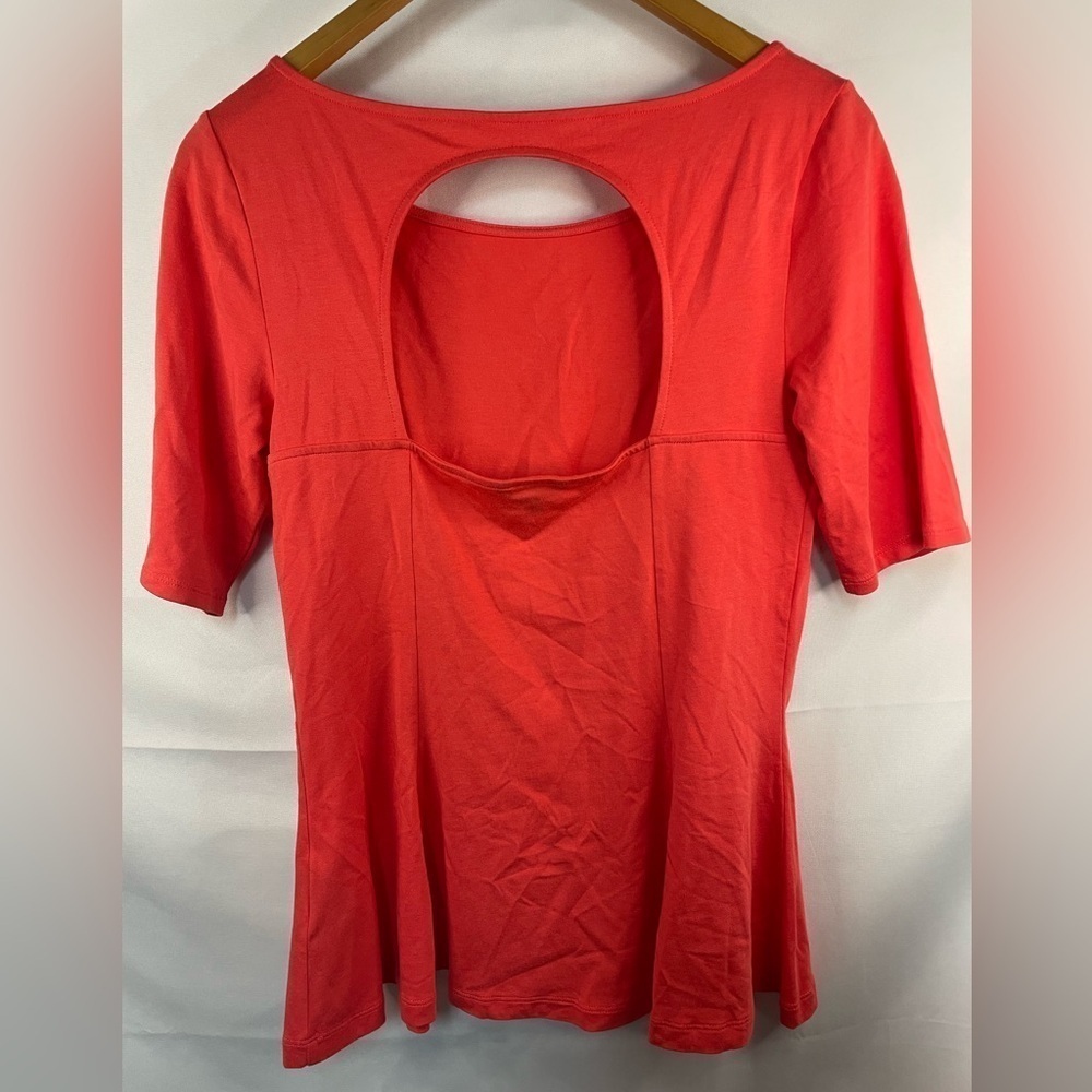 GUESS bright coral peplum blouse with an open back. Stretchy and soft!